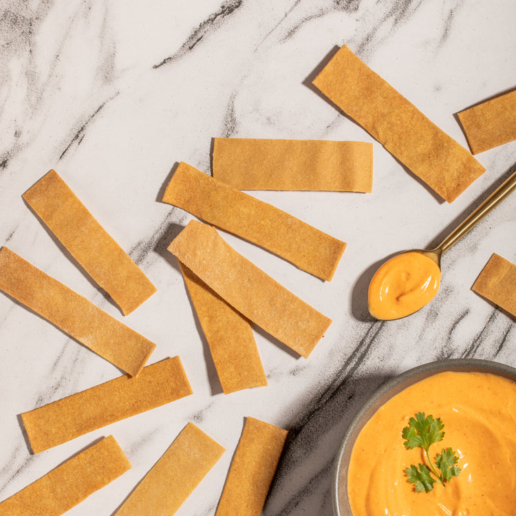 Vegan cheese crackers and a bowl of dip