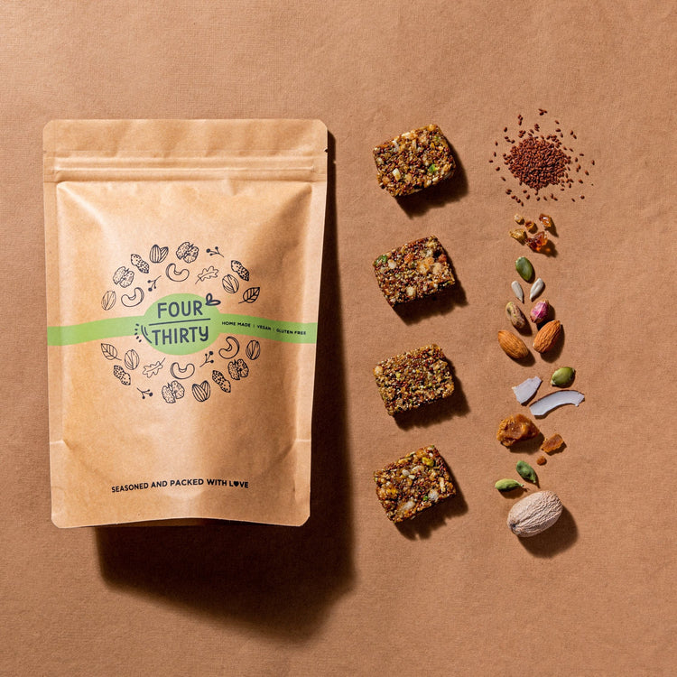 Aaliv Crunch your immunity booster against a brown background with ingredients placed around.