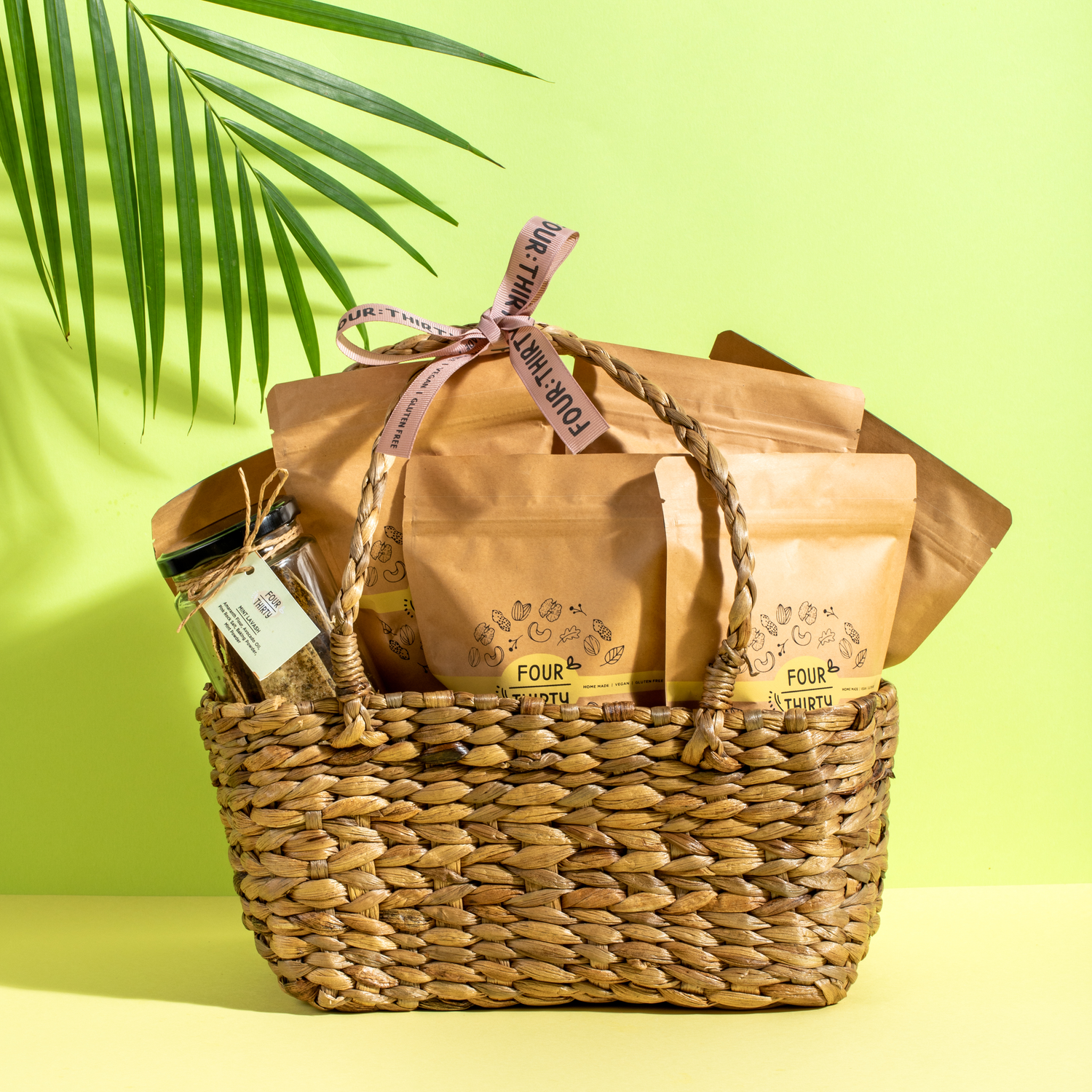 A basket full of different food packets from Four Thirty with a bow on the top