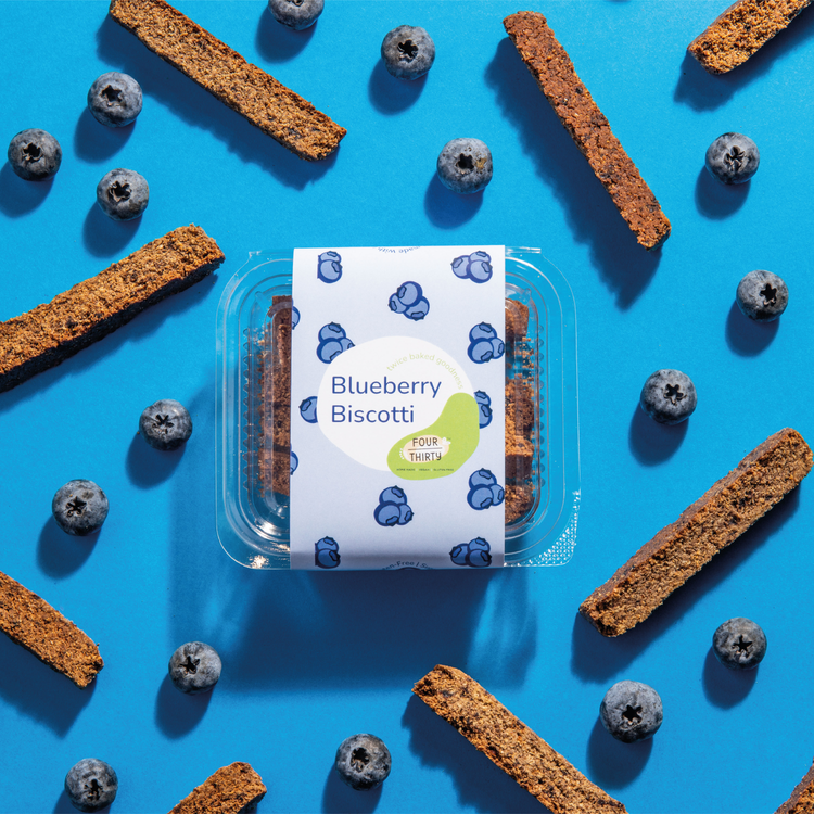 Blueberry Biscotti with blueberries & sticks around it 