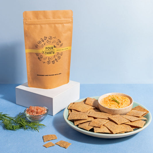 Artisan four thirty dill crackers in a rustic wooden bowl, highlighting a healthy and flavorful snack option.